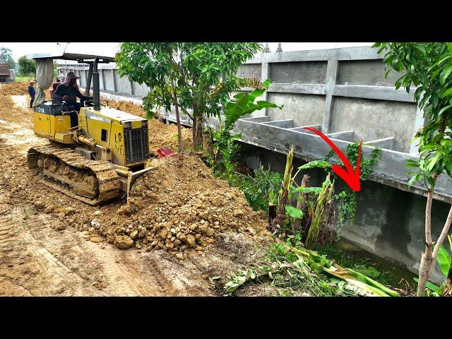 Small Bulldozer Working Filling Down The Wall With 5T&25T Dump Truck Loading Soil