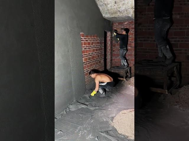 Plastered concrete on red brick wall indoors