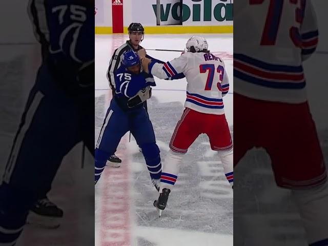 Matt Rempe & Ryan Reaves throwing punches at center ice 