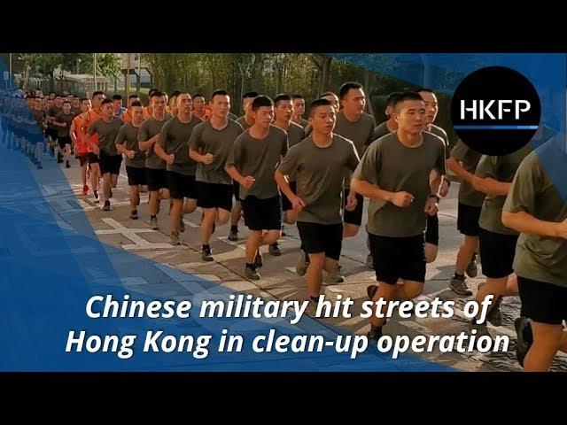 Chinese military troops 'clean up' Hong Kong streets, in first 'deployment' since protests began