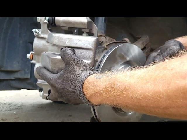 2011 Honda Ridgeline front brake caliper rotor and pad replacement with gravity bleeding.