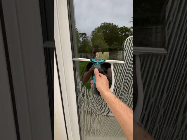 Person does a really satisfying window cleaning!