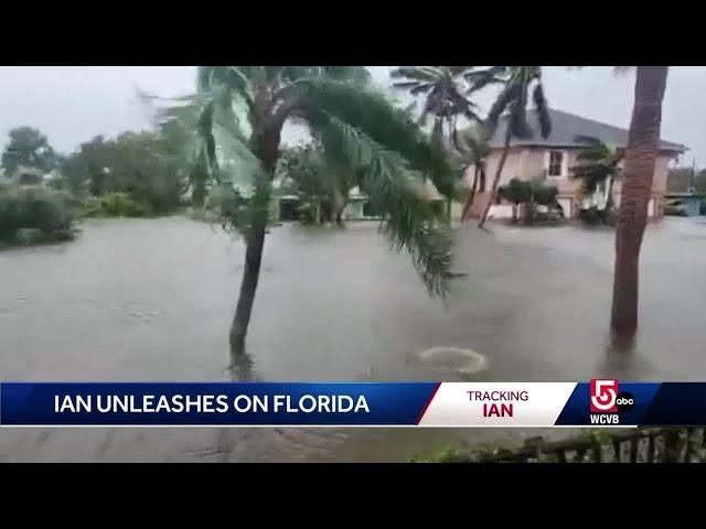 Ian's water rises to tree tops, roofs in Naples