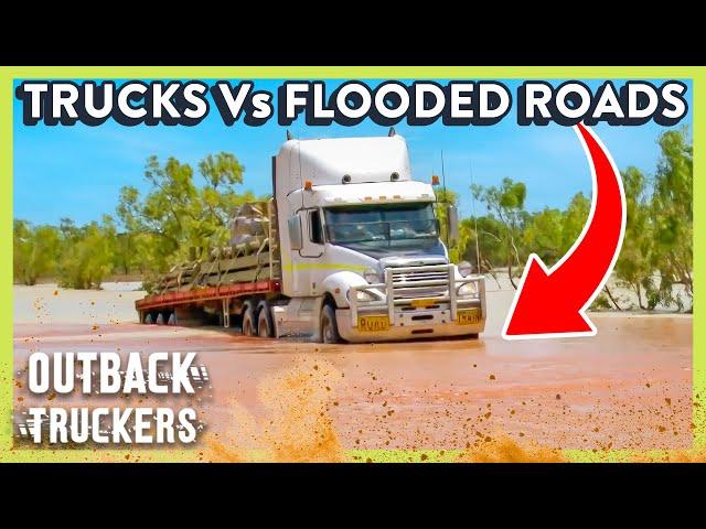 Trucks Drive Head-On Into Deep Flood Waters