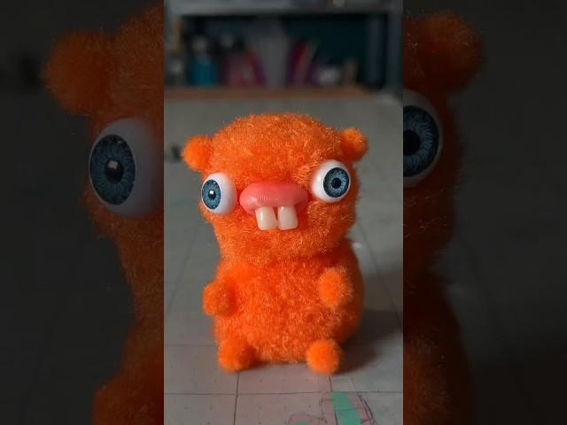Making a weird creature out of Pom poms and hot glue