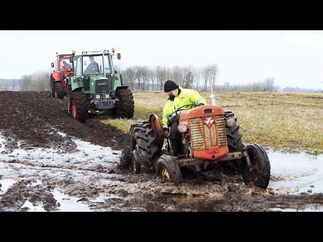 Vintage Tractors Plowing in Wet Condition