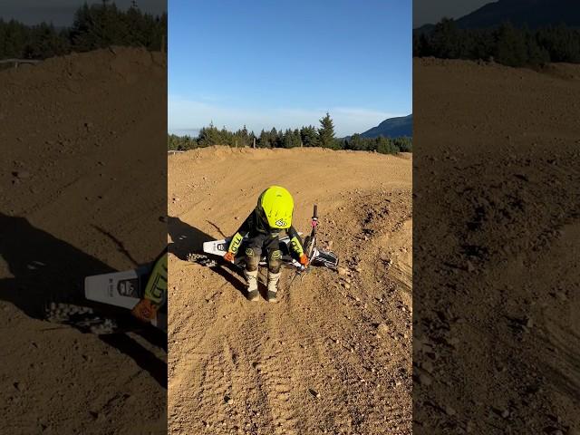 learning to pick up his dirt bike by himself