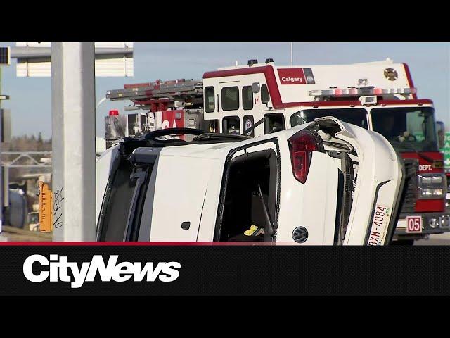 Crash involving school bus, flipped SUV in SW Calgary