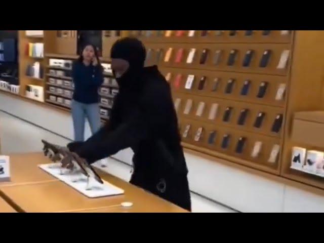 This is insanity!!! Man Steals 100 iPhones while the Police was outside the store