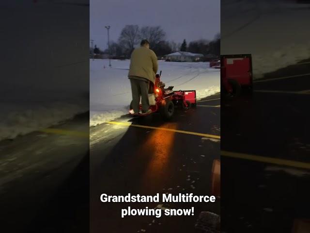 Toro grandstand multiforce plowing snow