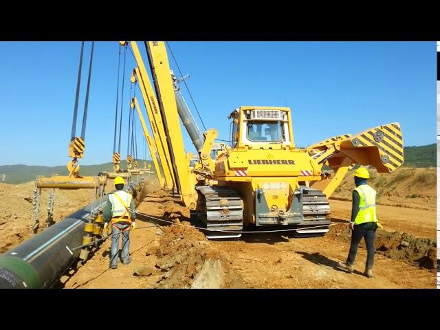 Gas Pipeline Construction - Pipeline Lowering in to the trench in normal terrain.