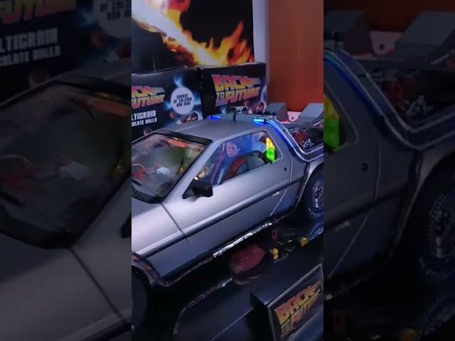 Delorean with Doc, Marty and Biff NECA figures.