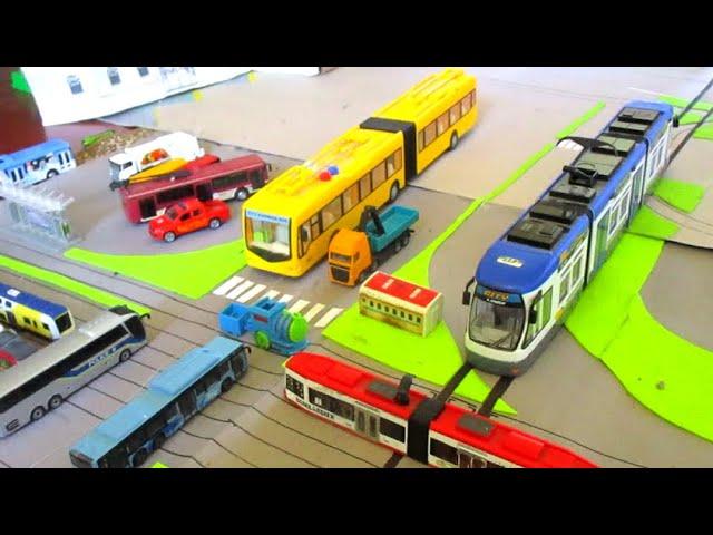 Siku 1683 Roll-off tipper with crane / Majorette Lion's City bus/ Articulated Trolleybus / Siku Tram