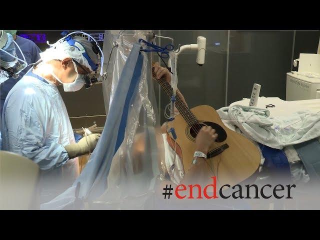 Brain tumor patient plays guitar during awake craniotomy surgery