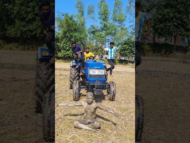 Statue in front of tractor