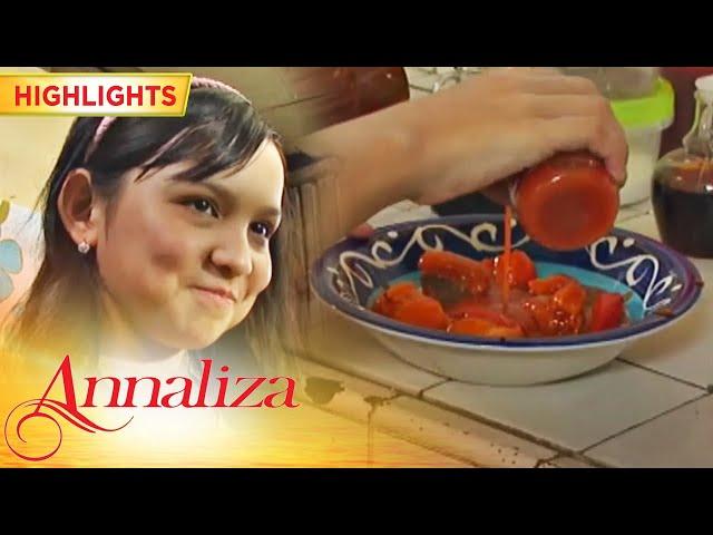 Arlene pours hot sauce all over the dish Annaliza has prepared | Annaliza