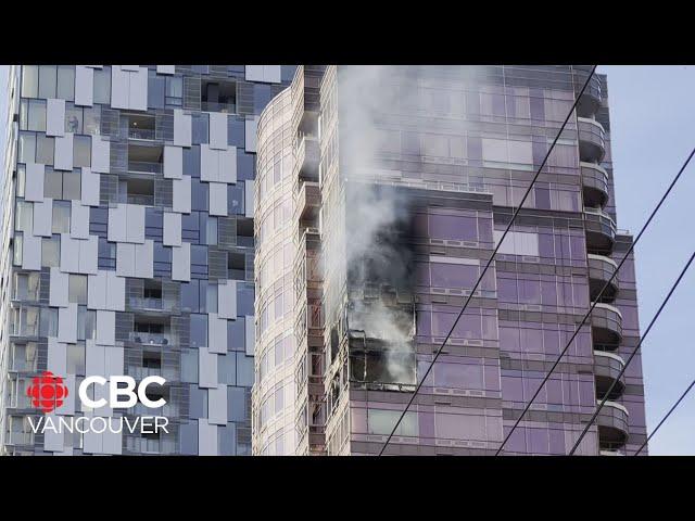 Apartment highrise fire in Vancouver's Coal Harbour sends debris flying