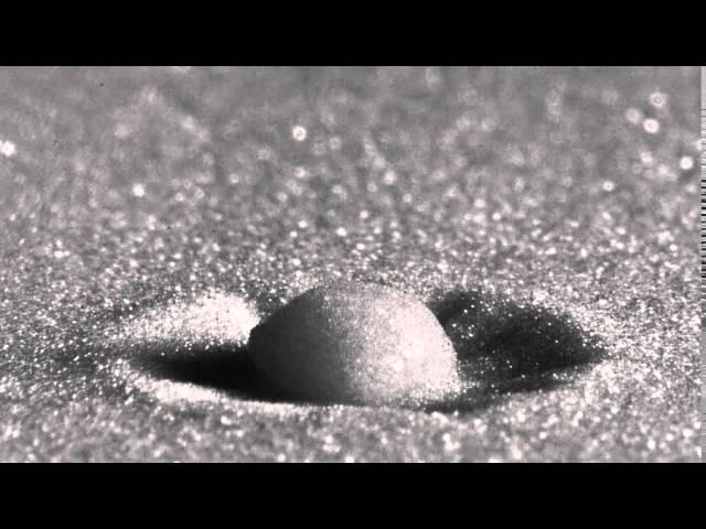 Raindrop Impact on a Sandy Surface