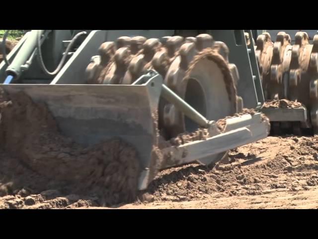 1140th Engineer  Battalion resurfaces Sikeston rodeo arena.