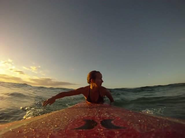 Sunset surfer girl Daize Shayne Goodwin and a GoPro HD