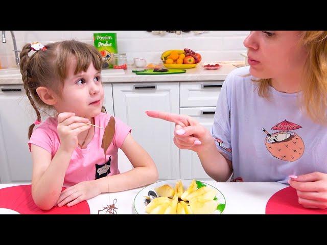 Eva and mom play edible and inedible chocolate stuff. Candy toys for kids