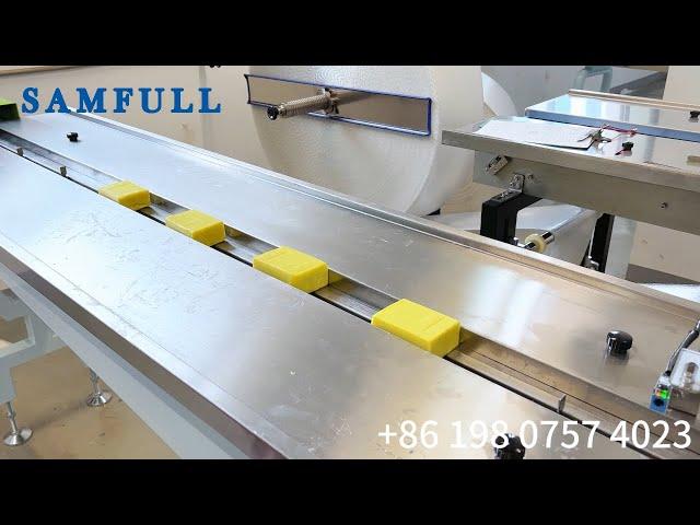 Horizontal soap bar flow wrap machine