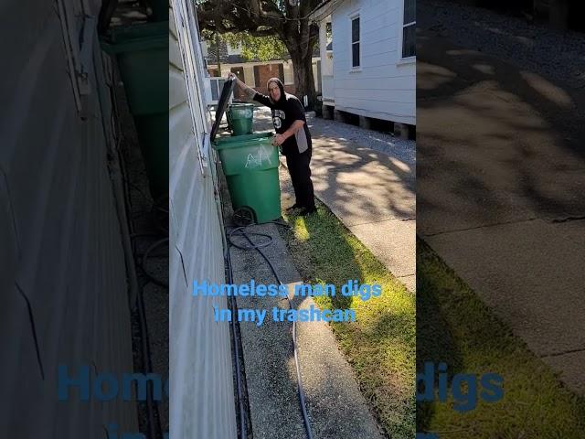 homeless guy digging through trash for food