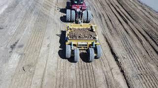 TOOMEY 4000B Scraper behind an STX450 digging in hard clay with the teeth cutting edges.