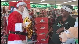 Santa surprising the Dollar Tree Manager with a gift for Christmas 2024