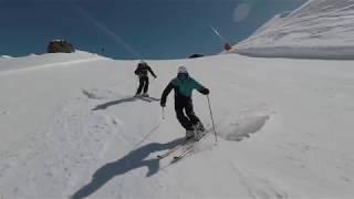 Demonstration- Skiing short turns on a black run