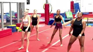 Gymcats dance warm up to Billy Joel's "Uptown Girl"