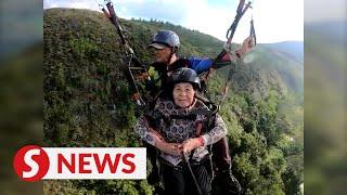 87-year-old daredevil creates buzz online for paragliding in Ranau