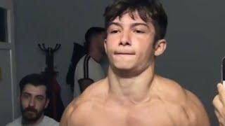 15 years old teen boy flexing muscle