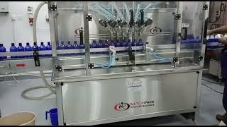 Bottle Filling Machine - Electronic Liquid Filling - Oil Filling Machine - Machpack +91-9978447909