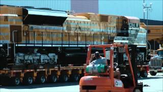 Caterpillar Electro - motive train being moved by road