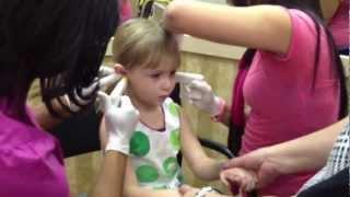 Katherine getting her ears pierced!