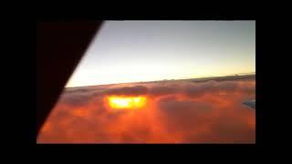 Sun rise under the clouds at FL280