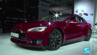 Tesla defies Wall Street expectations and turns profit