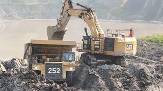 Caterpillar 6015B Excavator Loading Mud