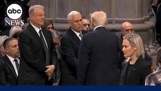 Trump shakes hands with Mike Pence at Jimmy Carter funeral