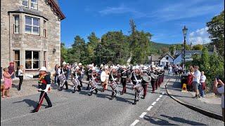 The Band of HM Royal Marines Scotland playing on march to the 2024 Braemar Gathering Highland Games