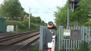 Pendolino at 125Mph Through Level Crossing