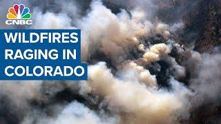 Wildfires are raging in Colorado, destroying homes and forcing hundreds to evacuate