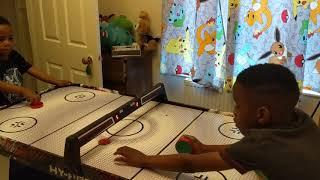 Geran and Nyle play air hockey. Good reviews for the hy pro from argos