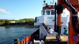 MV Felsted being towed off pier at Balvicar Boatyard