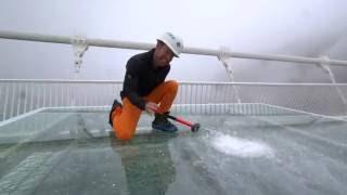 China's giant glass bridge hit with sledgehammer - BBC Click