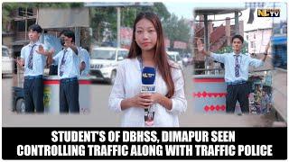 STUDENT'S OF DBHSS, DIMAPUR SEEN CONTROLLING TRAFFIC ALONG WITH TRAFFIC POLICE