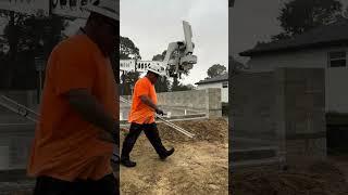 Laying cinderblock in a DOWNPOUR with robots