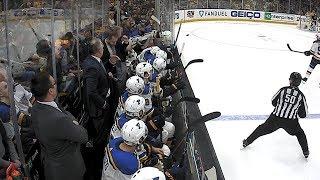 Jake Allen gloves puck on bench, gifts souvenir to young fan