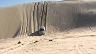 Rexton going down a sand dune